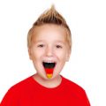 boy in red shirt with german flag on his tongue